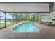 Screened in pool with views of the lake at 15007 Laurel Cove Cir, Odessa, FL 33556