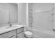 Clean, modern bathroom with gray vanity, white countertop, and shower-tub combination at 17382 Alderwood Ln, Punta Gorda, FL 33982