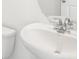 This bathroom features a white toilet and sink with chrome hardware at 3544 Moscato Dr, Brooksville, FL 34602