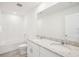 Bathroom features double sink vanity with granite counter and white tile at 3544 Moscato Dr, Brooksville, FL 34602