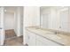 Elegant bathroom featuring double sink vanity, granite countertops, and a large mirror at 3544 Moscato Dr, Brooksville, FL 34602