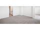 Spacious bedroom with plush carpeting, neutral walls, and ample natural light, ready for personalization at 3544 Moscato Dr, Brooksville, FL 34602