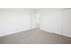 Bedroom with neutral carpeting and sliding closet doors at 3544 Moscato Dr, Brooksville, FL 34602