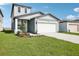 Charming two-story home with a well-maintained lawn, two car garage and meticulous landscaping at 3544 Moscato Dr, Brooksville, FL 34602