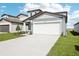 Charming single-Gathering home with a two-car garage and well-manicured lawn at 3544 Moscato Dr, Brooksville, FL 34602
