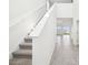 View of staircase and main hallway with high ceilings, neutral walls, and ample natural light at 3544 Moscato Dr, Brooksville, FL 34602
