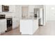 Modern kitchen with stainless steel appliances, white cabinetry and granite countertops at 3544 Moscato Dr, Brooksville, FL 34602