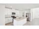 Modern kitchen features granite countertops, stainless steel appliances, and bright white cabinets at 3544 Moscato Dr, Brooksville, FL 34602