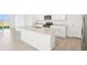 Modern kitchen features granite countertops, stainless steel appliances, and bright white cabinets at 3544 Moscato Dr, Brooksville, FL 34602