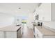 Modern kitchen featuring granite countertops, stainless steel appliances, and white cabinetry at 3544 Moscato Dr, Brooksville, FL 34602