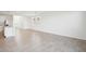 Open concept living space with ceramic tile floors and a view of the kitchen at 3544 Moscato Dr, Brooksville, FL 34602