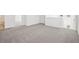 Bright open-plan living room with gray carpet and natural light at 3544 Moscato Dr, Brooksville, FL 34602