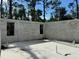 New concrete block foundation on a concrete slab ready for the next construction phase at 18141 Spartonvail Ave, Port Charlotte, FL 33954