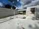 View of new home construction showing cinder block walls and concrete foundation in a sunny neighborhood at 18141 Spartonvail Ave, Port Charlotte, FL 33954