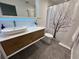 Modern bathroom featuring vessel sink, sleek vanity, and shower with decorative curtain at 1300 Pleasant S Way, St Petersburg, FL 33705