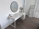 Bright bedroom featuring a white desk, decorative mirror and flowers with a chair at 1300 Pleasant S Way, St Petersburg, FL 33705