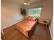 A bedroom features a neutral color scheme and a window with outside views at 1300 Pleasant S Way, St Petersburg, FL 33705