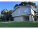 Exterior elevation of home with a blue front door at 1300 Pleasant S Way, St Petersburg, FL 33705