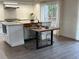 Contemporary kitchen island with modern dining setup at 1300 Pleasant S Way, St Petersburg, FL 33705