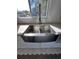 Modern kitchen sink with stainless steel appliances and a large window offering natural light at 1300 Pleasant S Way, St Petersburg, FL 33705