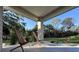 Covered front patio with modern chairs at 1300 Pleasant S Way, St Petersburg, FL 33705