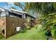 Green backyard with artificial turf and a wooden fence creates a private outdoor space at 132 17Th N Ave, St Petersburg, FL 33704