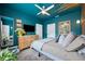 Stylish bedroom features unique accent wall, ceiling fan, and neutral tones for a serene ambiance at 132 17Th N Ave, St Petersburg, FL 33704
