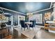 Elegant dining room featuring dark hardwood floors, a modern chandelier, and seating for four at 132 17Th N Ave, St Petersburg, FL 33704