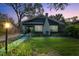 Charming home with lush landscaping, blue walkway, and inviting front porch at 132 17Th N Ave, St Petersburg, FL 33704