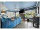 Cozy living room with a comfortable blue sofa, fireplace, and ample natural light at 132 17Th N Ave, St Petersburg, FL 33704