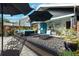 Charming outdoor lounge area with stylish seating, an umbrella and views into the patio at 132 17Th N Ave, St Petersburg, FL 33704