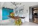 Bright sun room with stylish decor, seating, and a view into the dining room at 132 17Th N Ave, St Petersburg, FL 33704