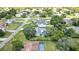Overview of a property showcasing its house, expansive yard, and neighborhood setting at 13295 Don Loop, Spring Hill, FL 34609