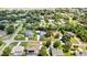 Spacious single-Gathering home featuring lush landscaping and a detached garage on a large lot at 13295 Don Loop, Spring Hill, FL 34609