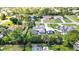 Aerial view of landscaped homes showcasing pools, carports, and lush surroundings at 13295 Don Loop, Spring Hill, FL 34609