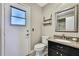 Small bathroom with vanity, granite countertop, and door leading to the outside at 13295 Don Loop, Spring Hill, FL 34609