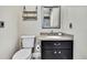 Neutral bathroom with modern sink and cabinet and decor shelves at 13295 Don Loop, Spring Hill, FL 34609