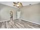 Spacious bedroom featuring light grey walls and an airy ceiling fan at 13295 Don Loop, Spring Hill, FL 34609