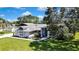 Inviting single-story home with a well-manicured lawn and charming curb appeal at 13295 Don Loop, Spring Hill, FL 34609