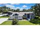 Inviting home with covered parking for an RV and mature landscaping at 13295 Don Loop, Spring Hill, FL 34609