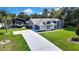 Beautiful single-story home with a covered parking area and a long driveway at 13295 Don Loop, Spring Hill, FL 34609