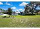 Beautiful home with inviting front yard, mature trees, and charming curb appeal at 13295 Don Loop, Spring Hill, FL 34609
