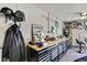 Well-organized garage with work bench, tools, and motorcycle helmets at 13295 Don Loop, Spring Hill, FL 34609