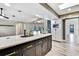Stylish kitchen features marble countertop, modern cabinetry and easy access to living area at 13295 Don Loop, Spring Hill, FL 34609