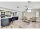 Open concept living area with wood-look flooring and stylish furniture at 13295 Don Loop, Spring Hill, FL 34609