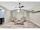Inviting living room features vaulted ceilings, wood-look floors, and stylish furniture at 13295 Don Loop, Spring Hill, FL 34609