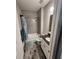 Modern bathroom with tiled shower and tub, granite vanity, and stylish gray-toned wood floors at 15301 Chinook Way, Port Charlotte, FL 33981
