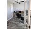 Modern office space with wood-look tile flooring and lots of natural light at 15301 Chinook Way, Port Charlotte, FL 33981