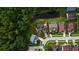 Aerial view outlining the property and showing its location relative to a pond and surrounding neighborhood at 28707 Raleigh Pl, Wesley Chapel, FL 33545
