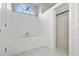 Bright bathroom featuring a soaking tub and walk-in shower with white subway tile at 28707 Raleigh Pl, Wesley Chapel, FL 33545